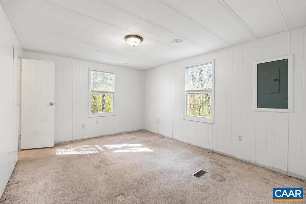 1066 Stevens Cove Road Lovingston, VA 22949 - Photo 15 of 34 an empty room with windows