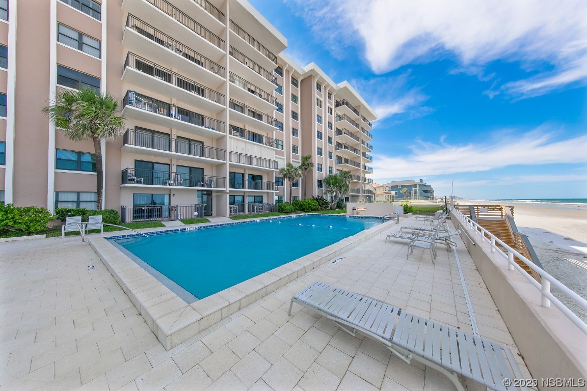 4435 South Atlantic Avenue, Unit 712 Ponce Inlet, FL 32127 - Photo 13 of 28 a view of building with yard