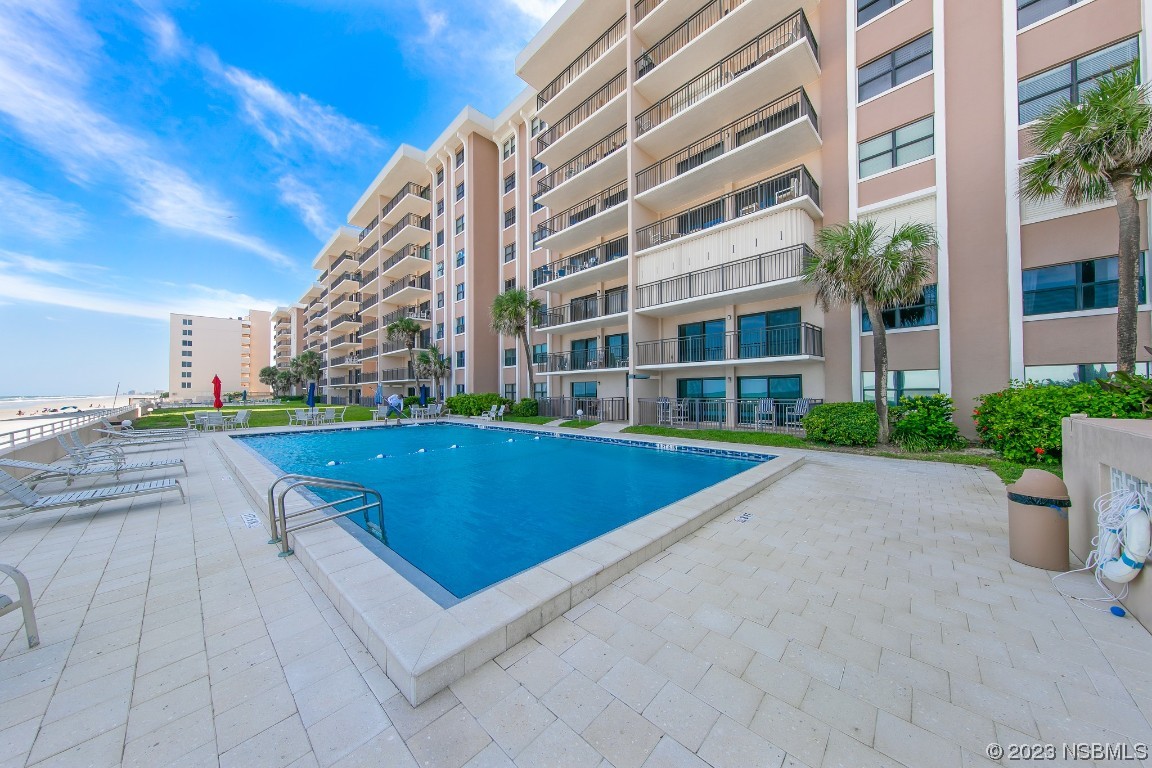 4435 South Atlantic Avenue, Unit 712 Ponce Inlet, FL 32127 - Photo 14 of 28 a view of building with yard