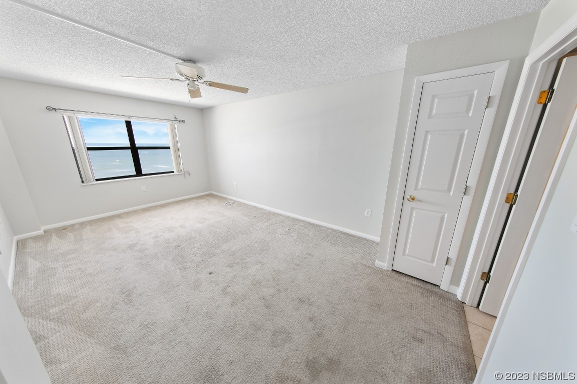 4435 South Atlantic Avenue, Unit 712 Ponce Inlet, FL 32127 - Photo 15 of 28 an empty room with windows and closet