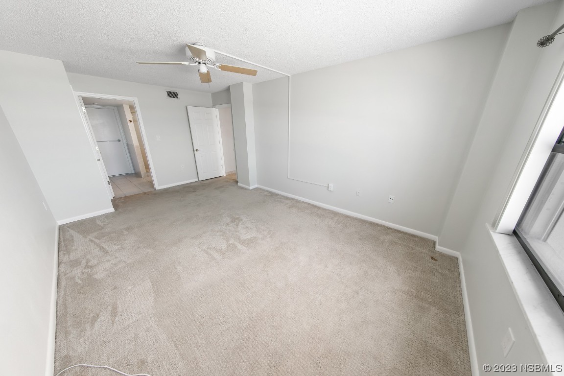 4435 South Atlantic Avenue, Unit 712 Ponce Inlet, FL 32127 - Photo 16 of 28 an empty room with a window