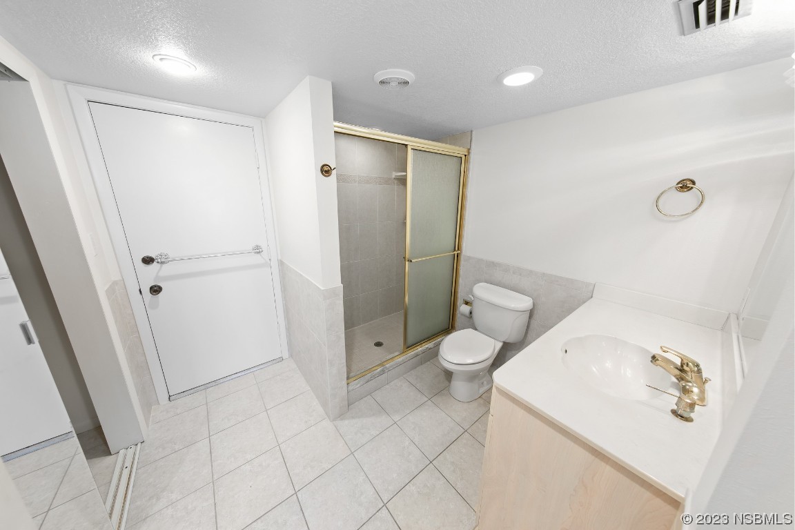 4435 South Atlantic Avenue, Unit 712 Ponce Inlet, FL 32127 - Photo 18 of 28 a bathroom with a toilet and a shower