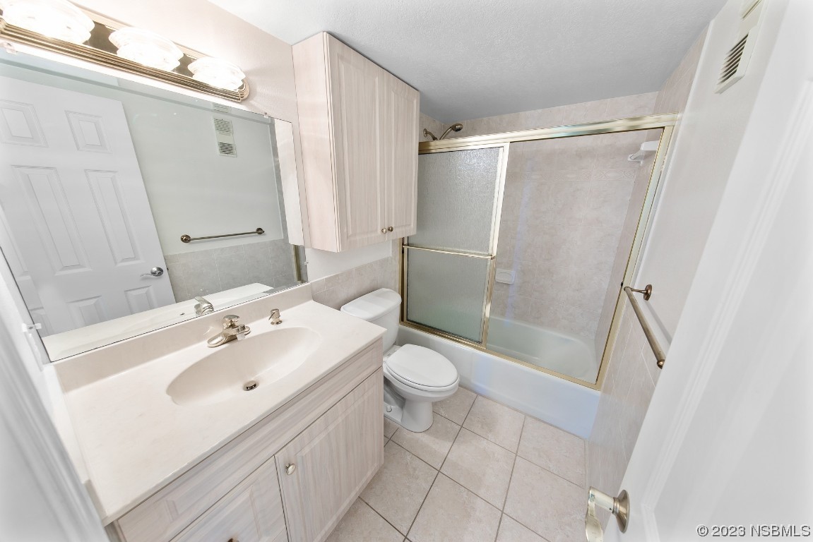 4435 South Atlantic Avenue, Unit 712 Ponce Inlet, FL 32127 - Photo 20 of 28 a bathroom with a sink toilet and shower