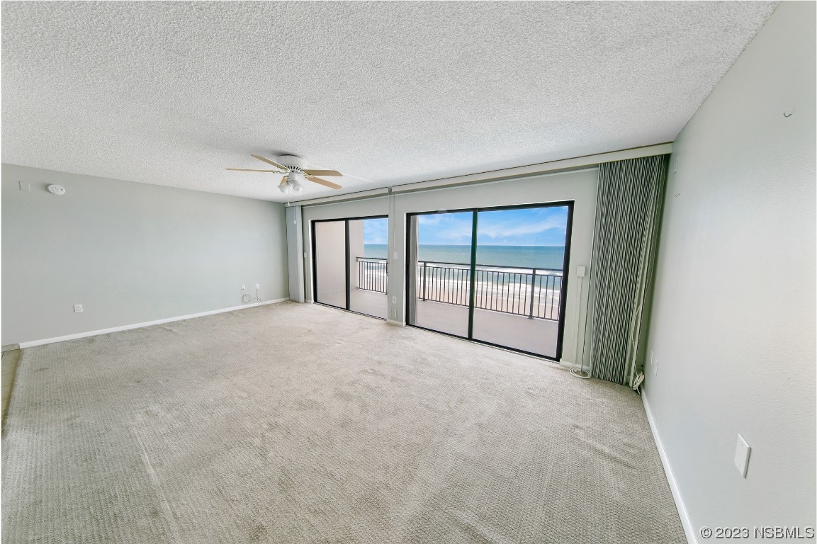4435 South Atlantic Avenue, Unit 712 Ponce Inlet, FL 32127 - Photo 4 of 28 a view of an empty room with a window