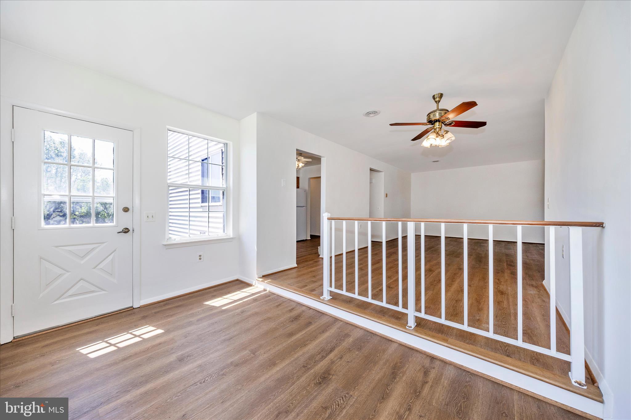 5738 Box Elder Court Frederick, MD 21703 - Photo 10 of 50 wooden floor in an empty room with a window