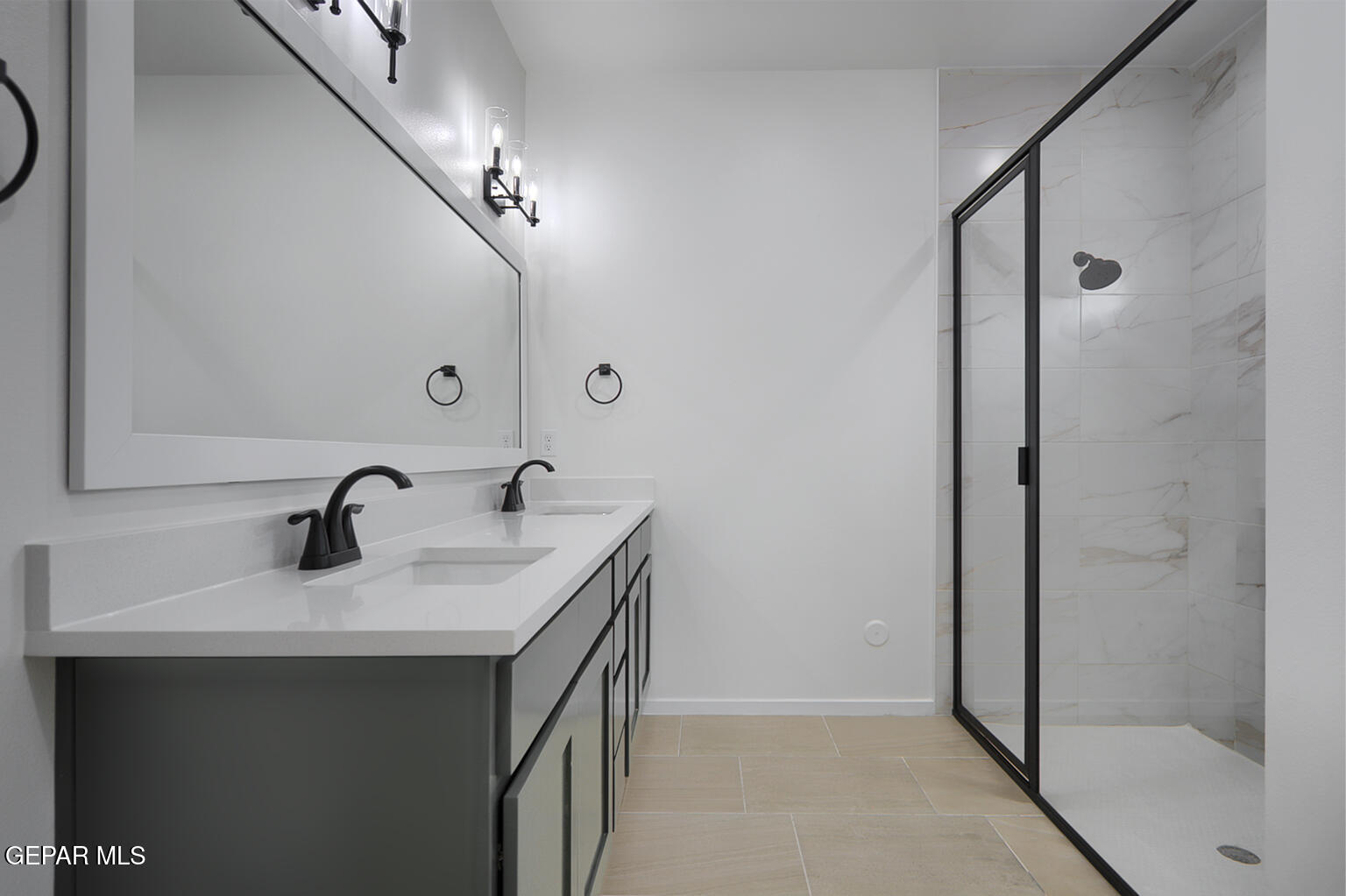 9913 Marisabel Socorro, TX 79927 - Photo 13 of 13 a bathroom with a sink and a mirror