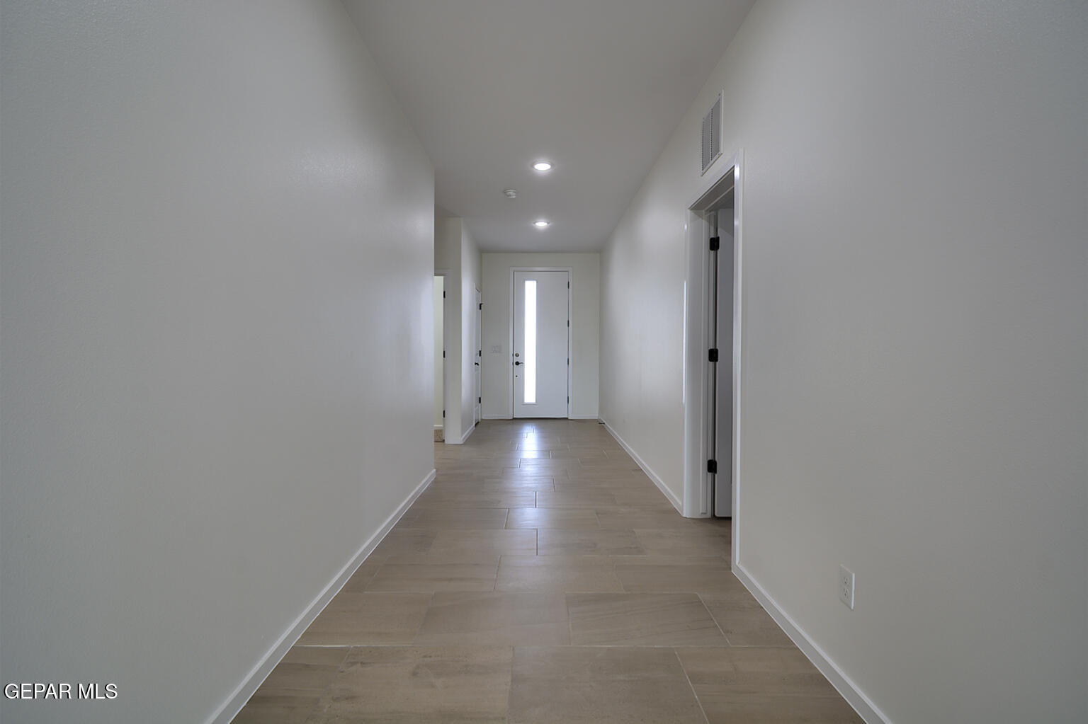 9913 Marisabel Socorro, TX 79927 - Photo 2 of 13 a view of hallway with wooden floor