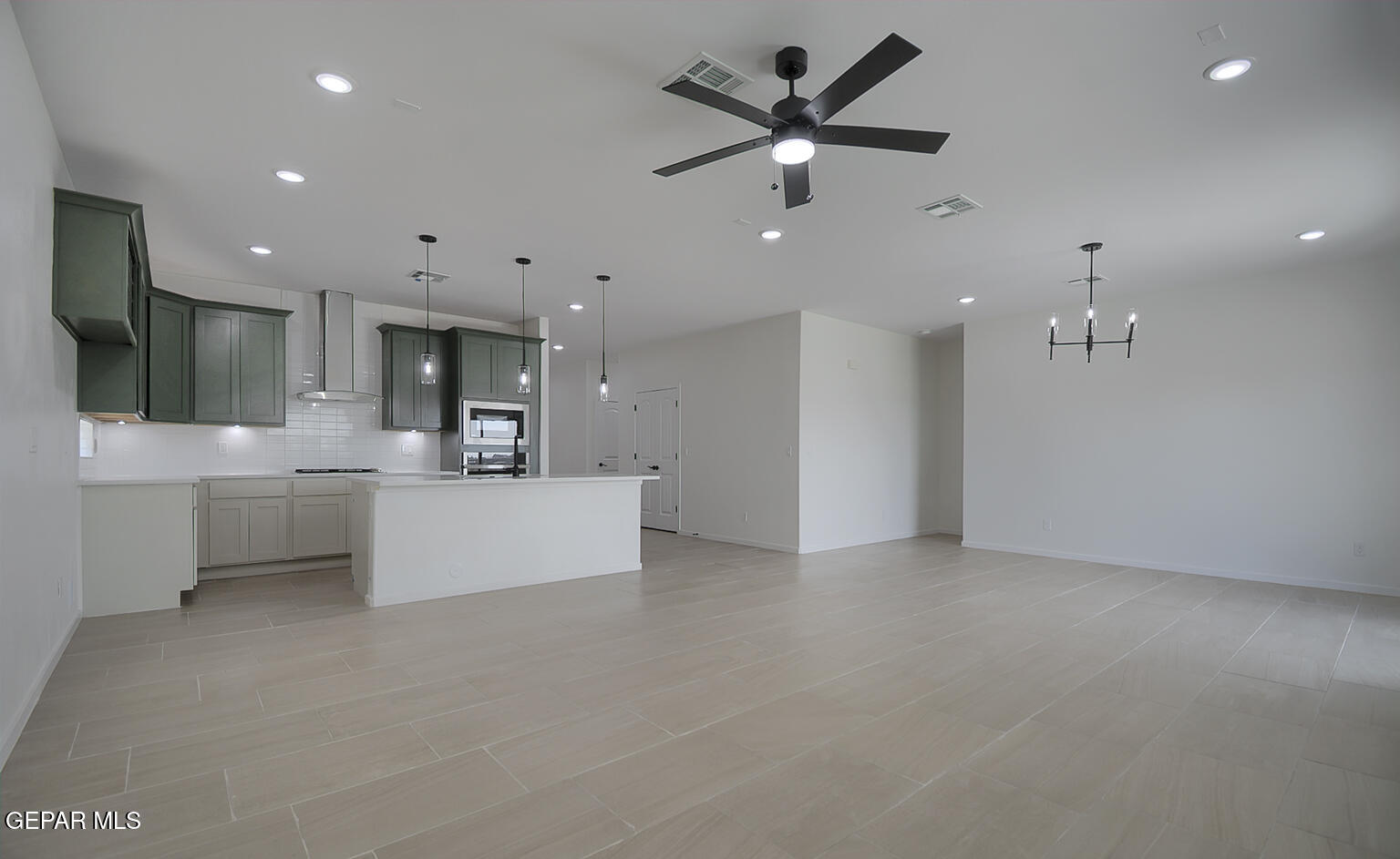 9913 Marisabel Socorro, TX 79927 - Photo 3 of 13 a view of a kitchen with marble kitchen and stainless steel appliances