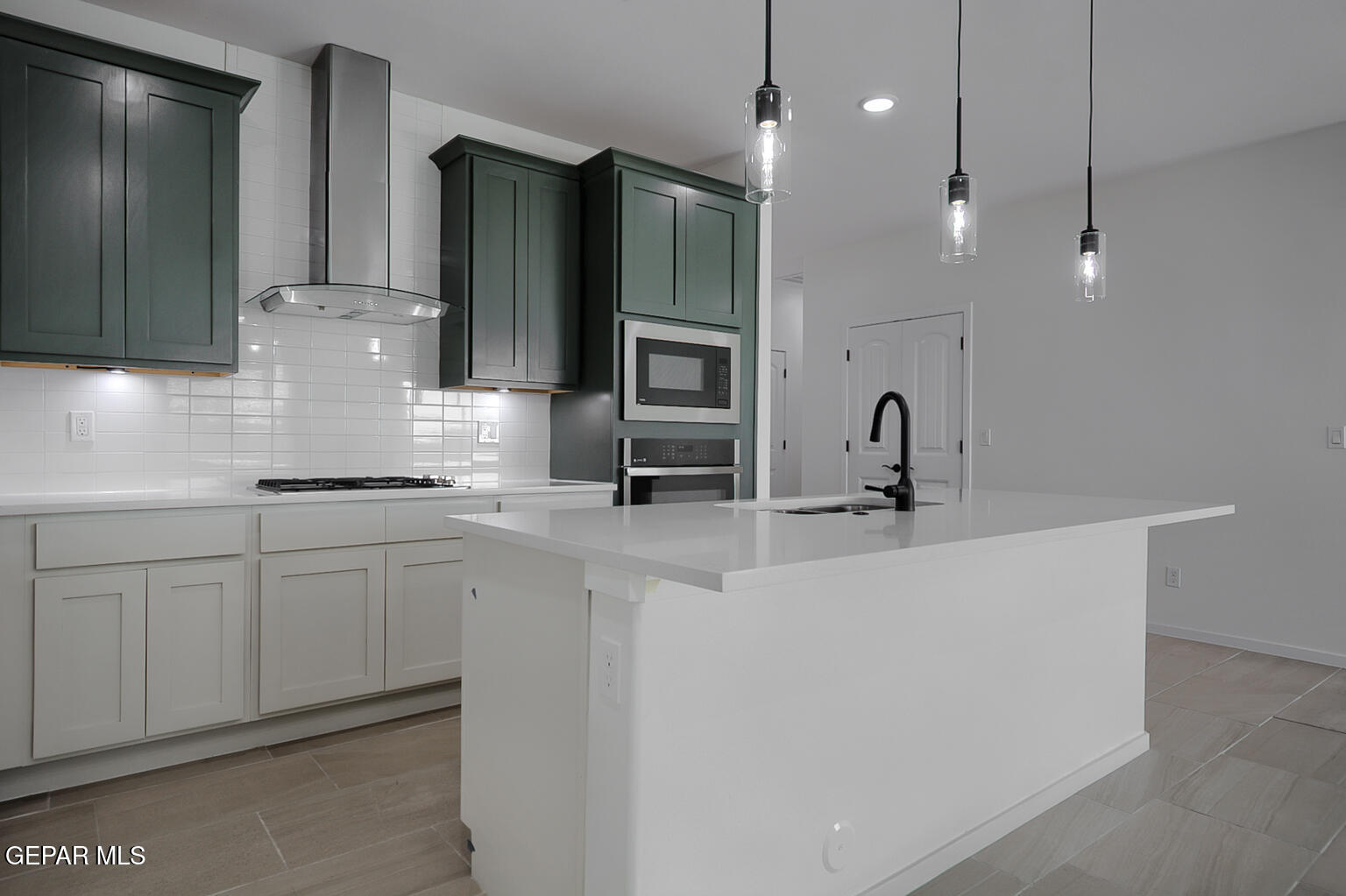 9913 Marisabel Socorro, TX 79927 - Photo 5 of 13 a kitchen with cabinets a sink and appliances