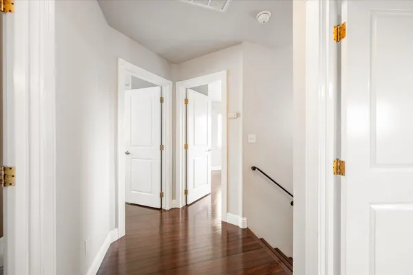 a view of an entryway with wooden floor