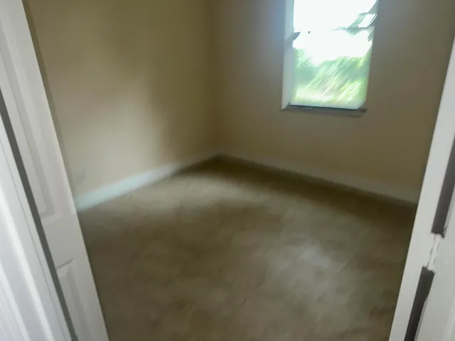 a view of an empty room and window