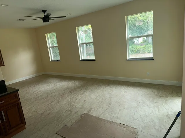 an empty room with windows