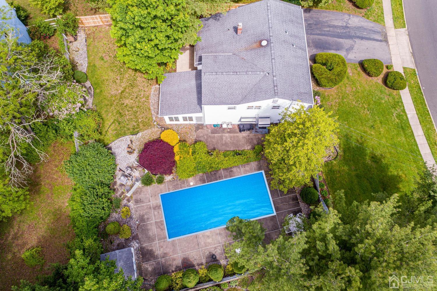 65 Drake Road Somerset, NJ 08873 - Photo 2 of 33 an aerial view of a house with a pool and a yard