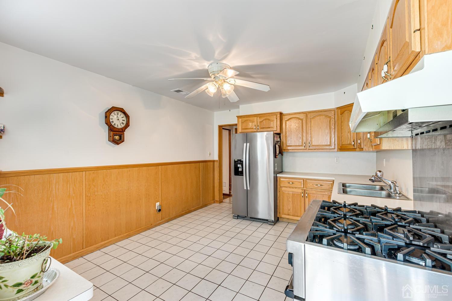 65 Drake Road Somerset, NJ 08873 - Photo 14 of 33 a kitchen with a refrigerator and a stove