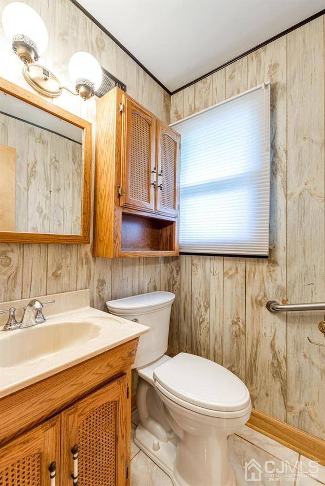 65 Drake Road Somerset, NJ 08873 - Photo 15 of 33 a bathroom with a sink a toilet and mirror