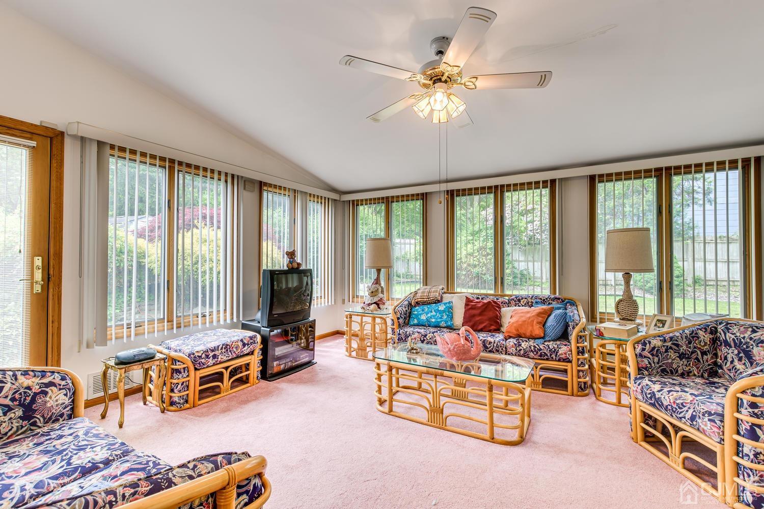 65 Drake Road Somerset, NJ 08873 - Photo 16 of 33 a living room with furniture and floor to ceiling windows