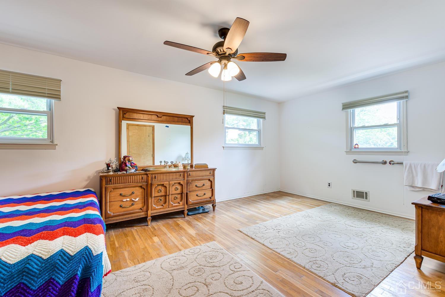 65 Drake Road Somerset, NJ 08873 - Photo 19 of 33 a bedroom with a bed and wooden floor