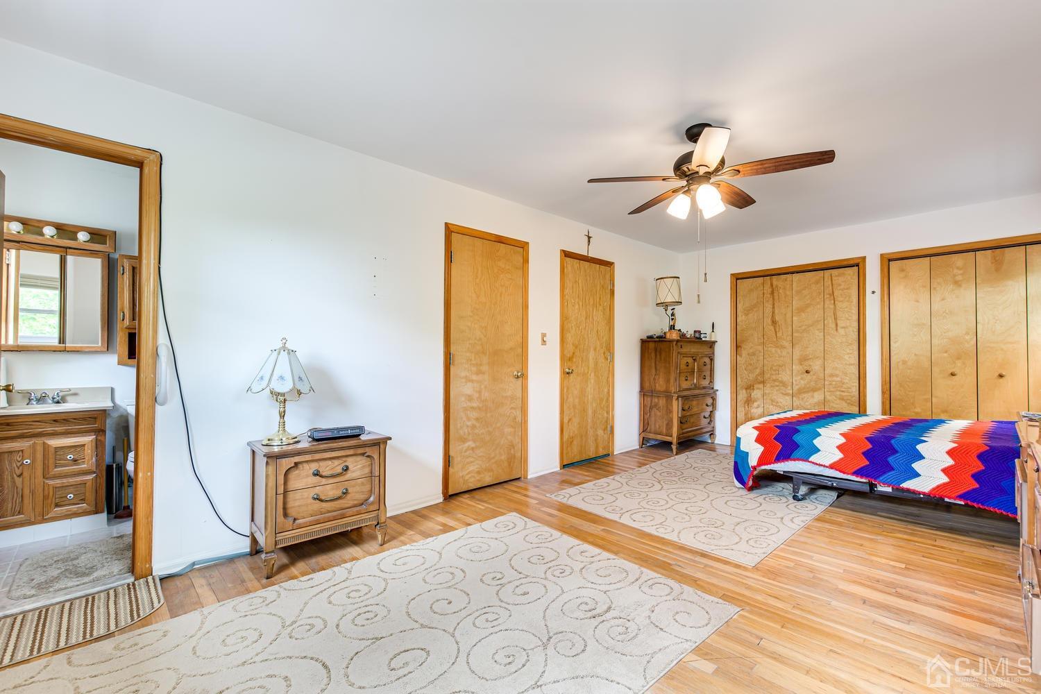 65 Drake Road Somerset, NJ 08873 - Photo 20 of 33 a bedroom with a bed and a chandelier