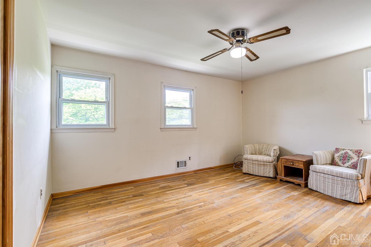 65 Drake Road Somerset, NJ 08873 - Photo 23 of 33 a view of room with wooden floor and ceiling fan