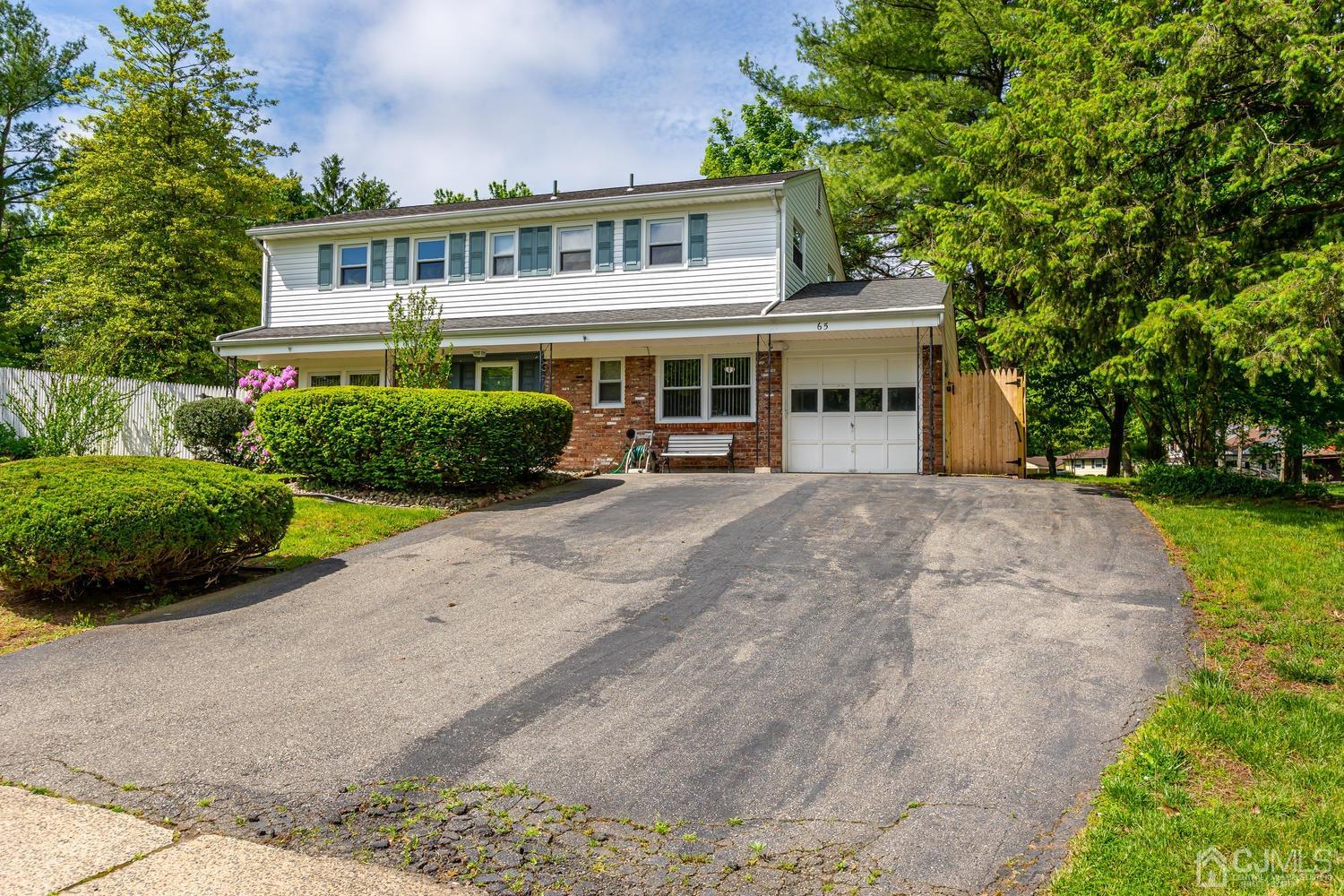 65 Drake Road Somerset, NJ 08873 - Photo 5 of 33 a front view of a house with a garden