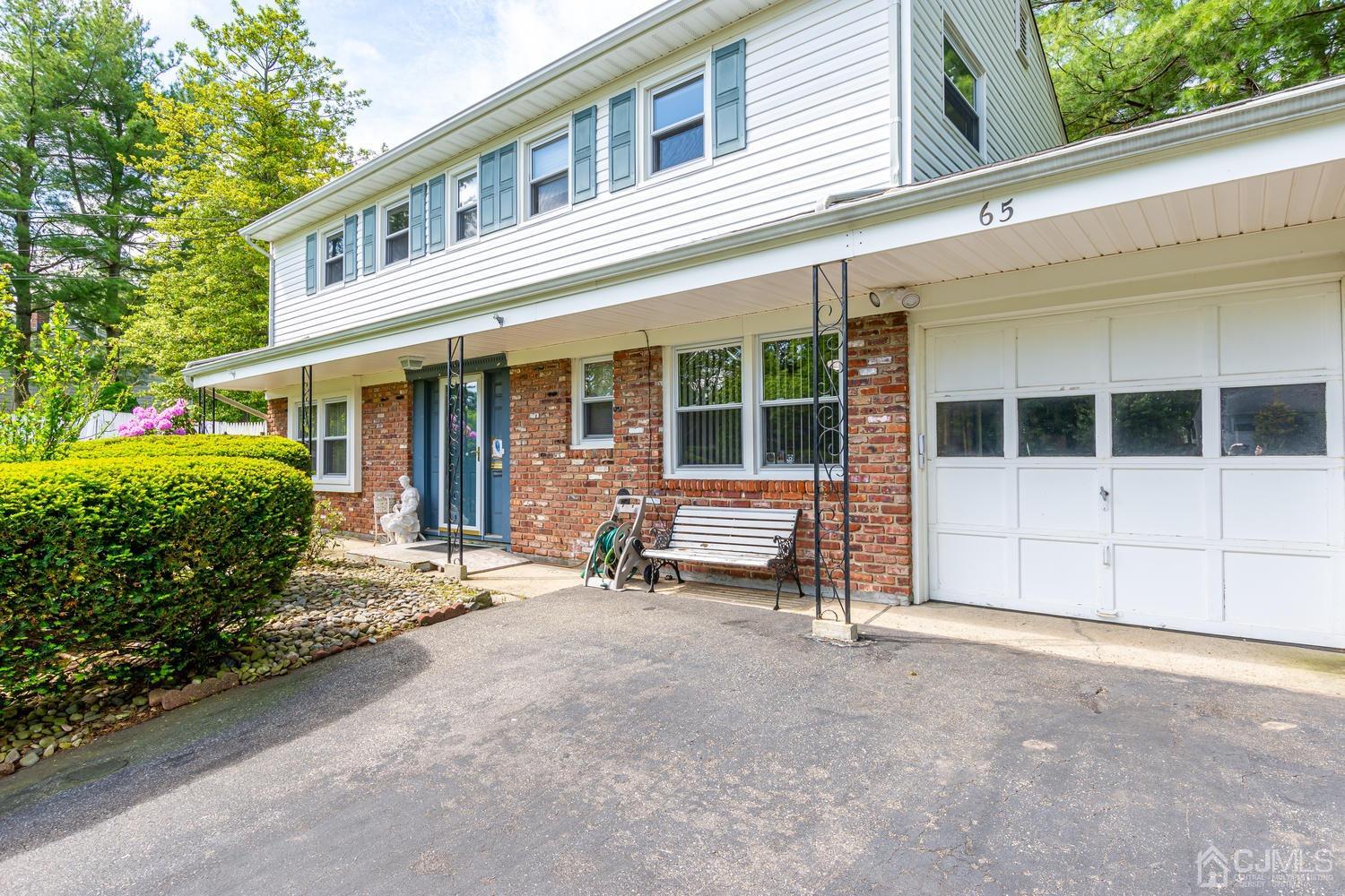 65 Drake Road Somerset, NJ 08873 - Photo 7 of 33 a view of a house with a large window and wooden fence