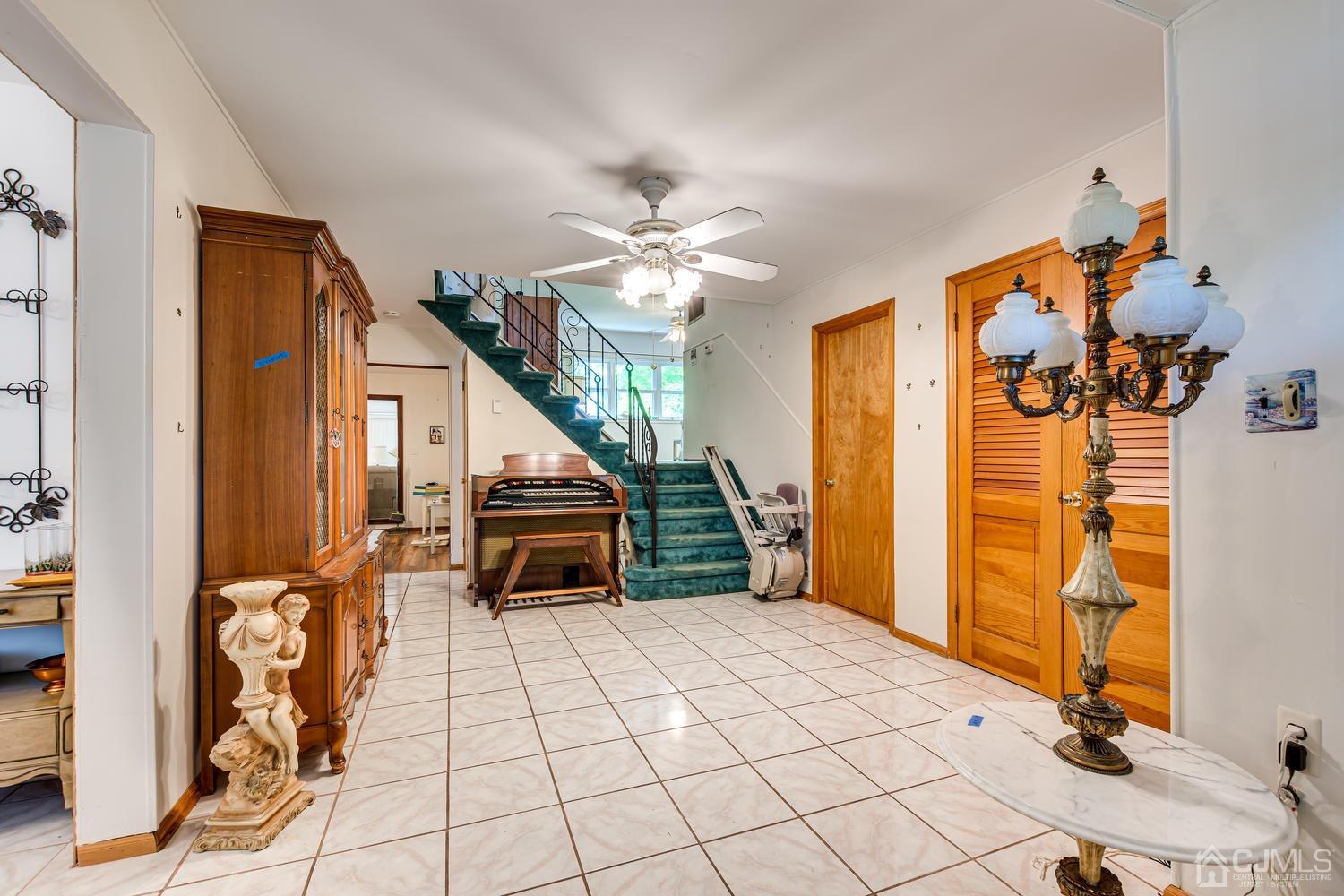 65 Drake Road Somerset, NJ 08873 - Photo 9 of 33 a bedroom with furniture and a chandelier