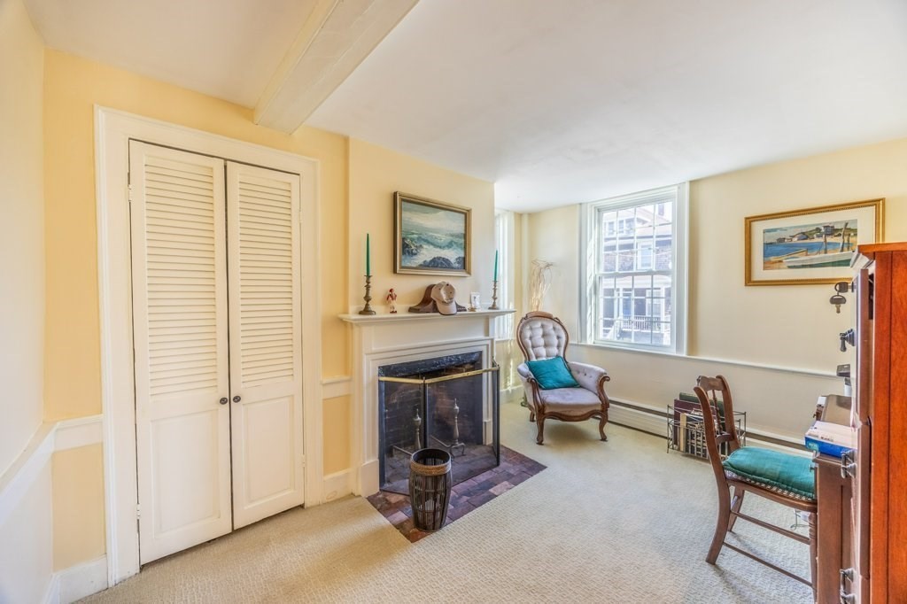 164 Main Street Fairhaven, MA 02719 - Photo 12 of 42 a living room with furniture and a fireplace