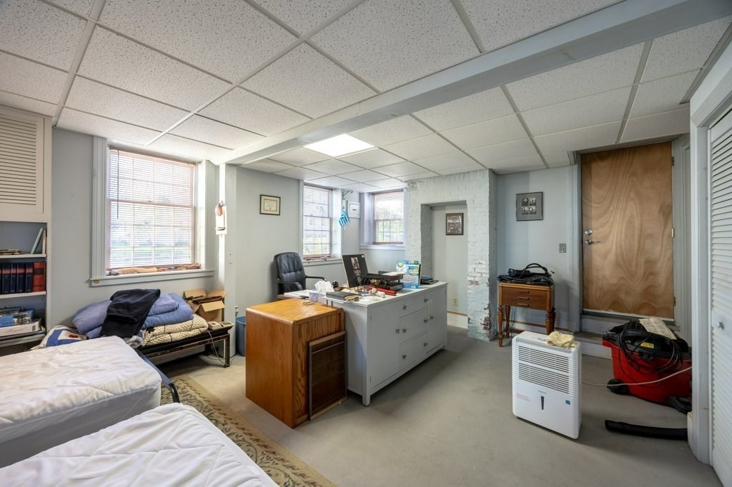 164 Main Street Fairhaven, MA 02719 - Photo 20 of 42 a bed room with a bed and a window