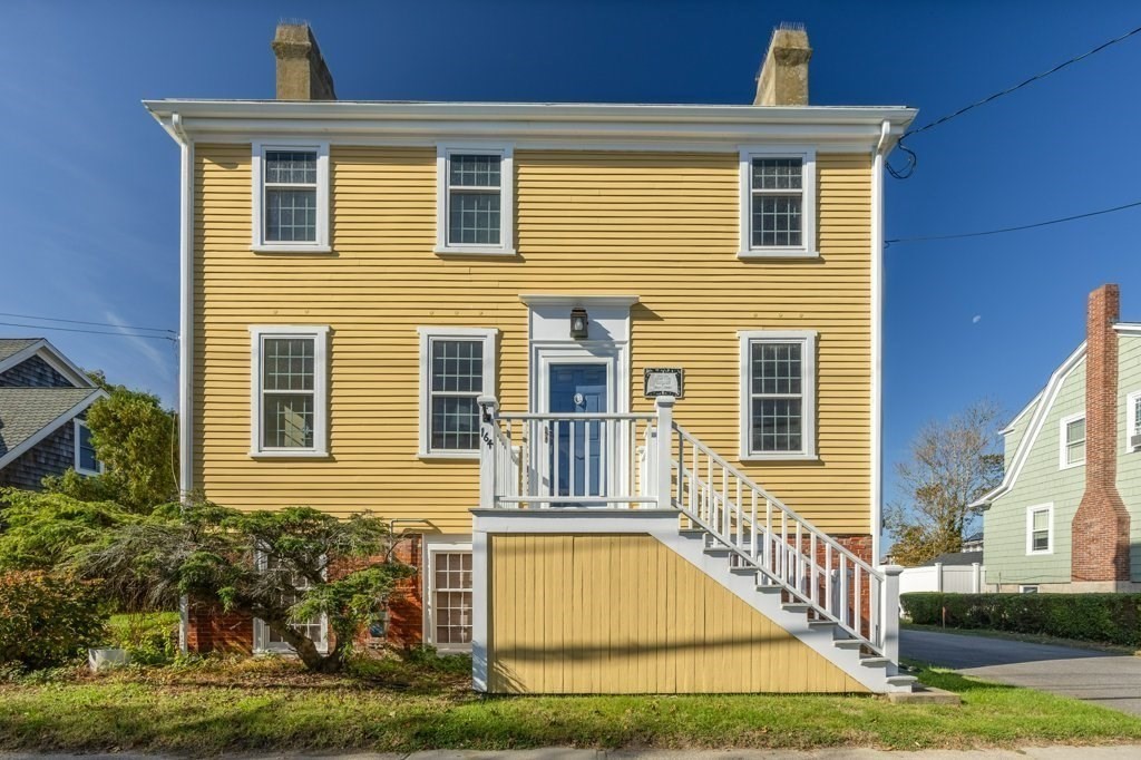 164 Main Street Fairhaven, MA 02719 - Photo 2 of 42 a front view of a house with a yard