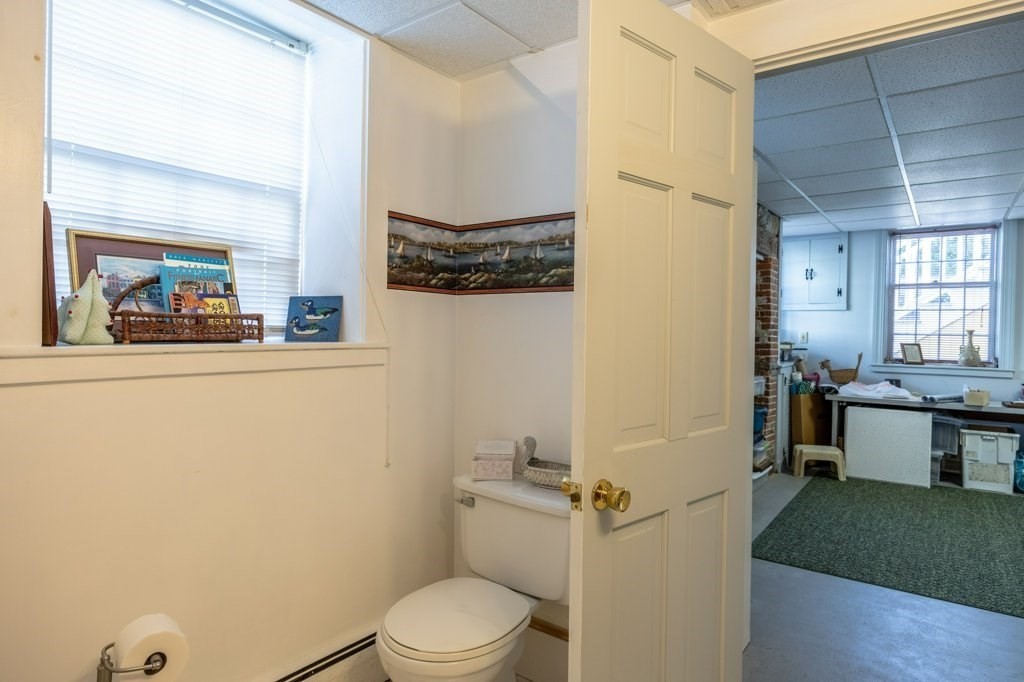 164 Main Street Fairhaven, MA 02719 - Photo 24 of 42 a bathroom with a sink a toilet and shower