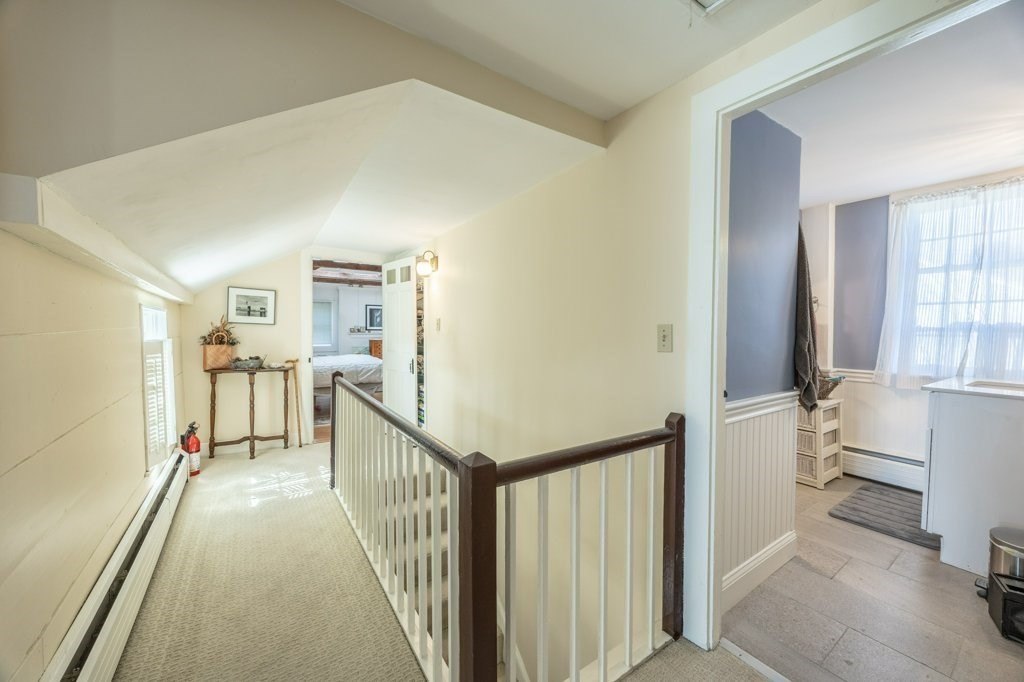 164 Main Street Fairhaven, MA 02719 - Photo 26 of 42 a view of a hallway with a livingroom and furniture