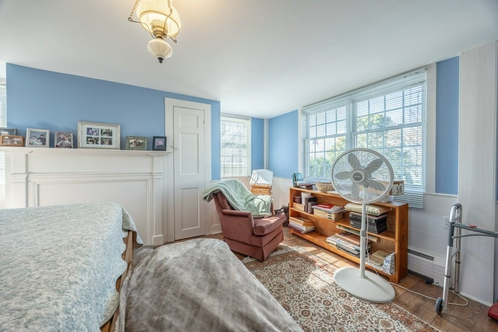 164 Main Street Fairhaven, MA 02719 - Photo 27 of 42 a living room with furniture a large window and a chandelier