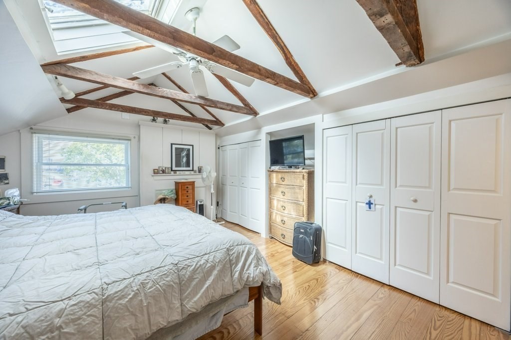 164 Main Street Fairhaven, MA 02719 - Photo 28 of 42 a bedroom with a bed and a window