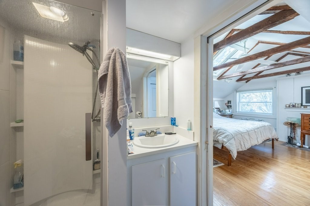 164 Main Street Fairhaven, MA 02719 - Photo 31 of 42 a bathroom with a double vanity sink and mirror
