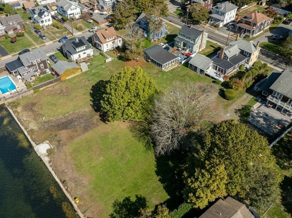 164 Main Street Fairhaven, MA 02719 - Photo 34 of 42 an aerial view of residential houses with outdoor space