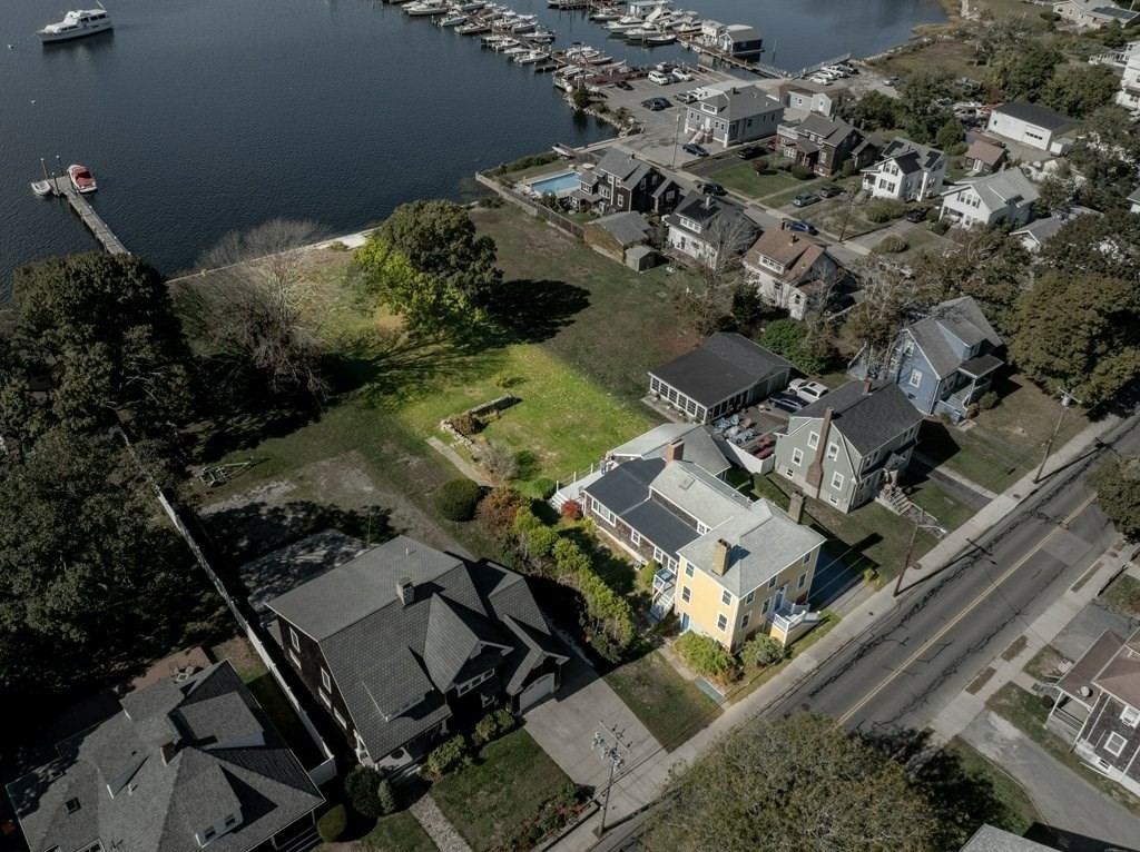 164 Main Street Fairhaven, MA 02719 - Photo 36 of 42 an aerial view of multiple houses with yard