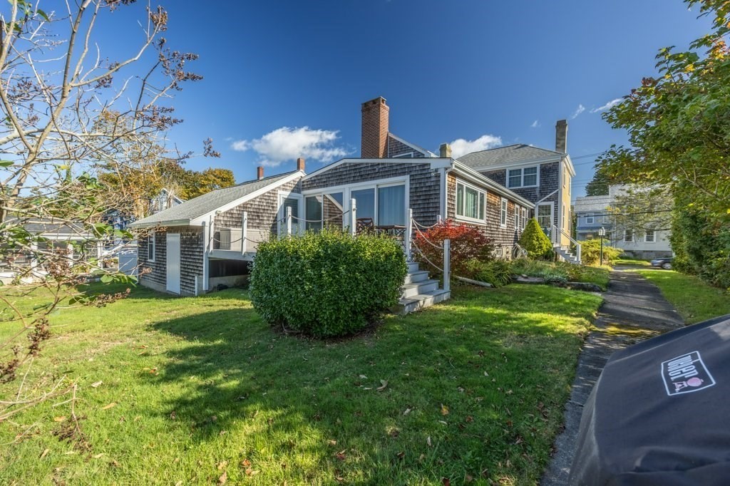 164 Main Street Fairhaven, MA 02719 - Photo 6 of 42 a front view of a house with garden
