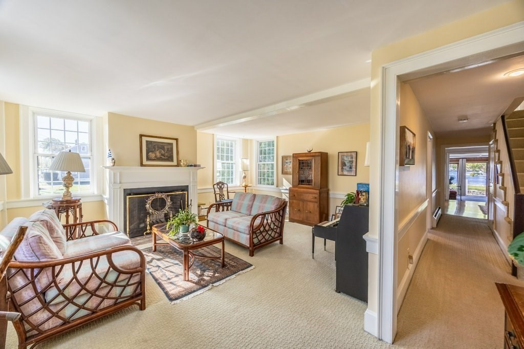 164 Main Street Fairhaven, MA 02719 - Photo 9 of 42 a living room with furniture and a fireplace
