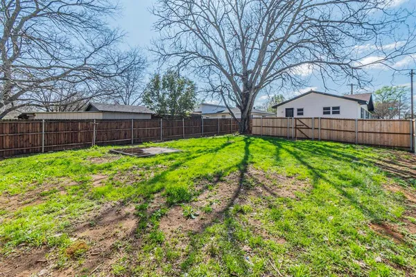 a view of a backyard with a small cabin