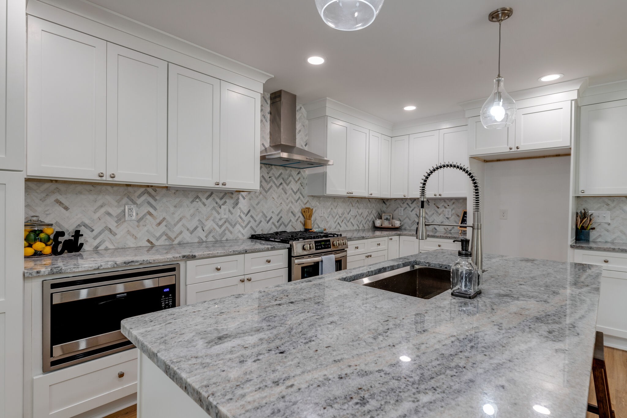 200 Shady Hill Road Dickson, TN 37055 - Photo 12 of 34 a kitchen with stainless steel appliances granite countertop a sink a stove a refrigerator and cabinets