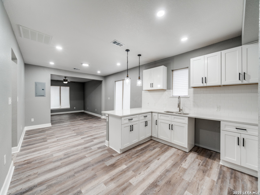 945 Potomac San Antonio, TX 78202 - Photo 5 of 14 a large kitchen with cabinets wooden floor and a stainless steel appliances