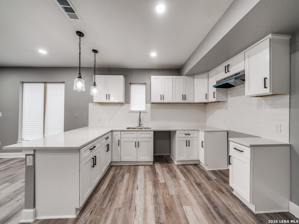 945 Potomac San Antonio, TX 78202 - Photo 7 of 14 a large kitchen with stainless steel appliances granite countertop a sink a stove and a refrigerator