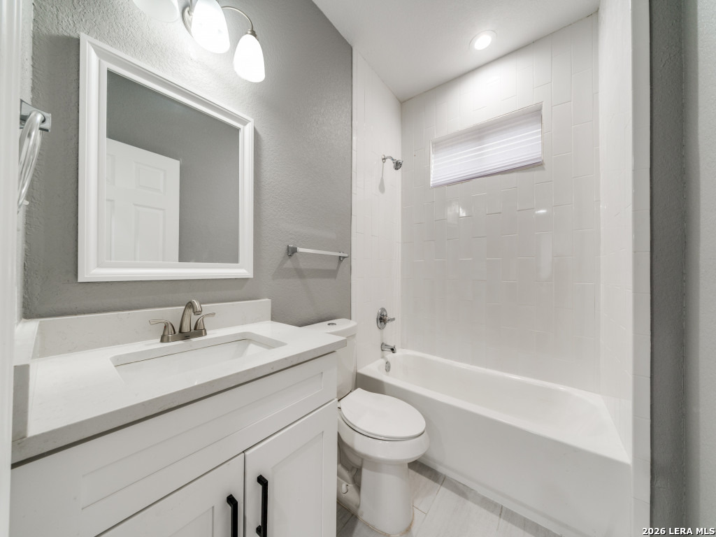 945 Potomac San Antonio, TX 78202 - Photo 9 of 14 a bathroom with a sink a toilet and shower