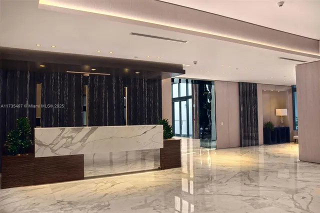 a view of a patio with couches table and chairs and potted plants