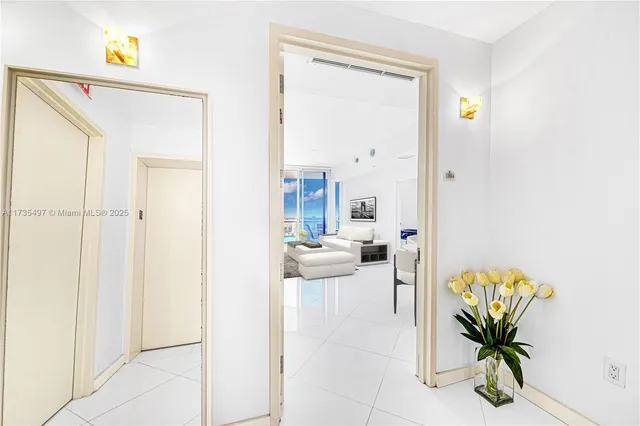 a view of a hallway with a potted plant