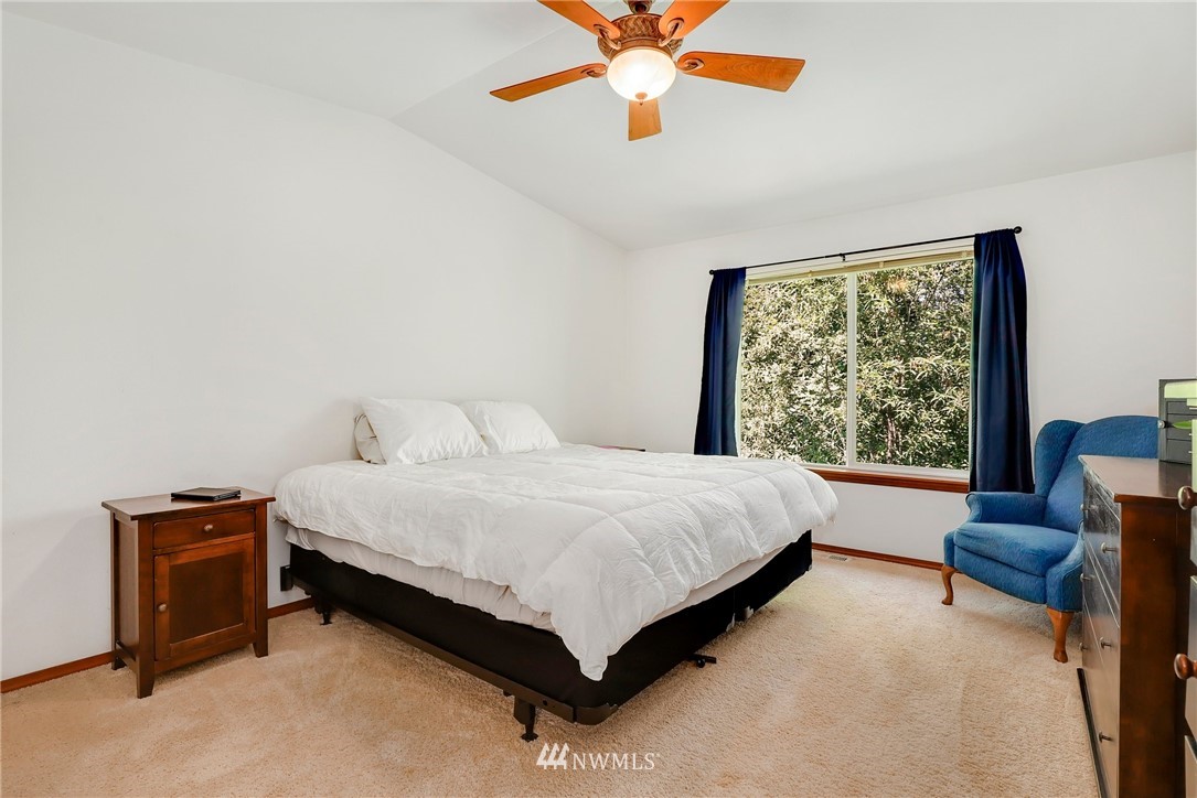 21351 11th Drive Southeast Bothell, WA 98021 - Photo 19 of 33 a bedroom with a bed and a couch