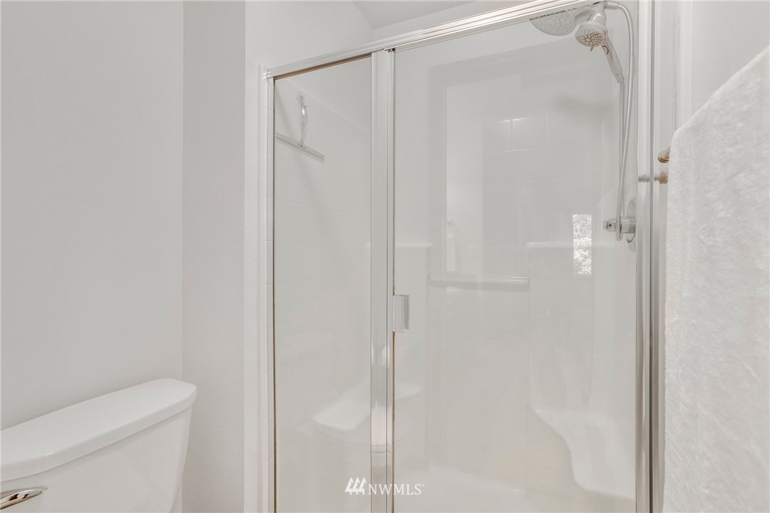 21351 11th Drive Southeast Bothell, WA 98021 - Photo 22 of 33 a bathroom with a shower and a toilet