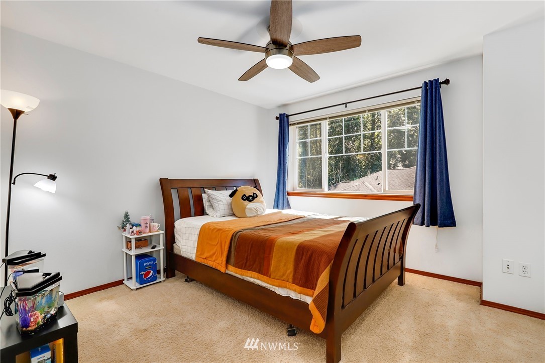 21351 11th Drive Southeast Bothell, WA 98021 - Photo 23 of 33 a bed room with a bed and a window