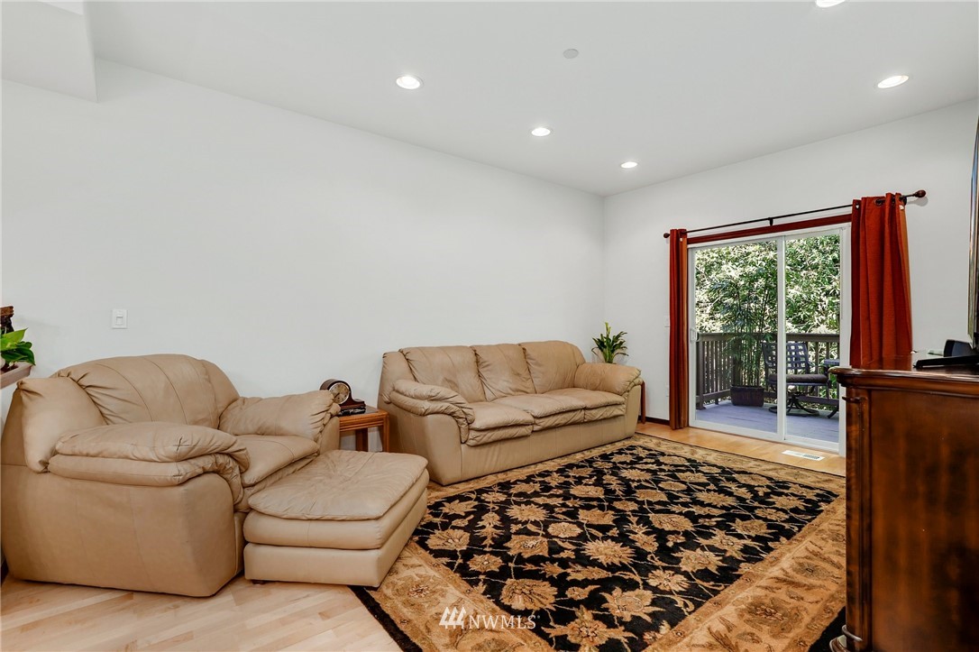 21351 11th Drive Southeast Bothell, WA 98021 - Photo 4 of 33 a living room with a couch and a window