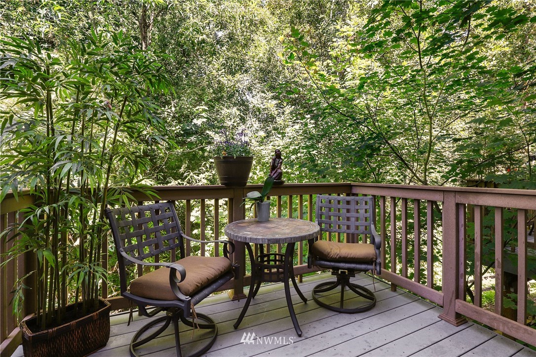 21351 11th Drive Southeast Bothell, WA 98021 - Photo 6 of 33 a balcony with wooden floor table and chairs